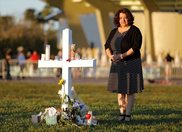 A mourner pays tribute to a victim of the shooting in Parkland, Florida