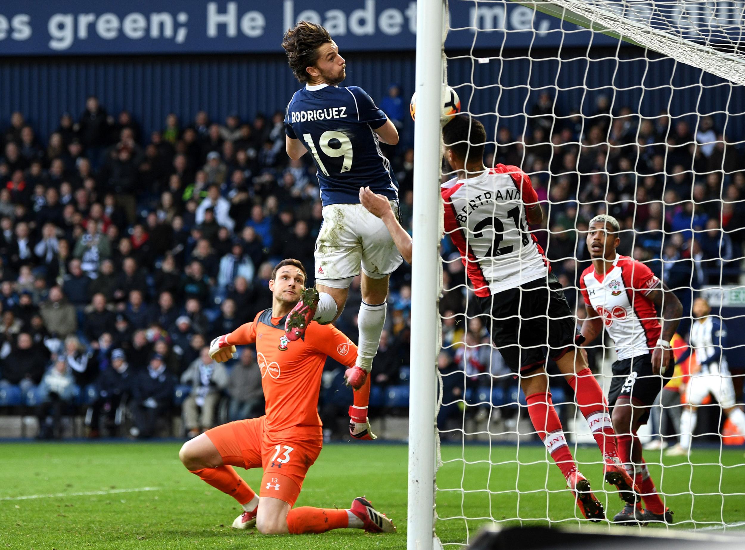 Ryan Bertrand clears Jay Rodriguez's header from off the line