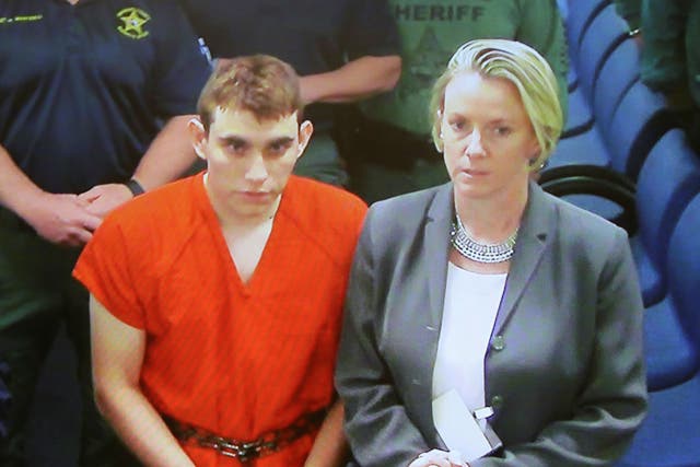 <p>File: Nikolas Cruz appears via video monitor with his public defender Melisa McNeill at a bond court hearing in Fort Lauderdale, Florida</p>