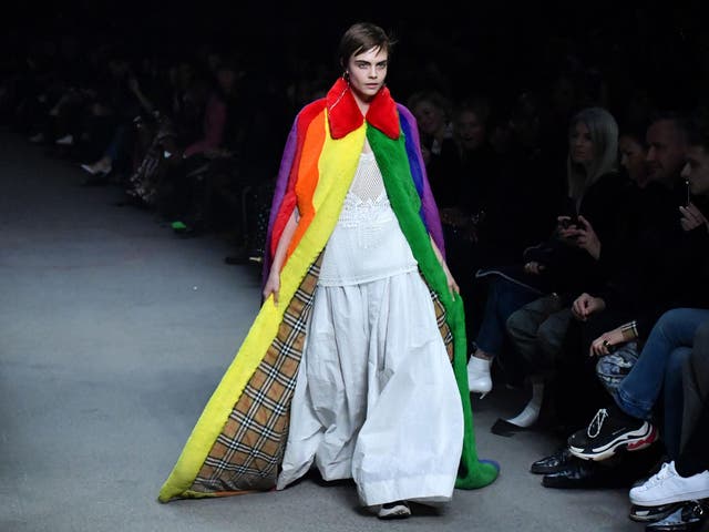 Cara Delevingne presents a Burberry creation during the brand’s catwalk show