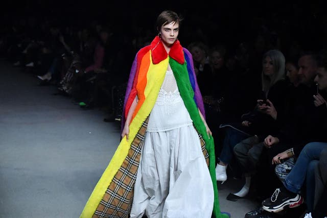 Cara Delevingne presents a Burberry creation during the brand’s catwalk show