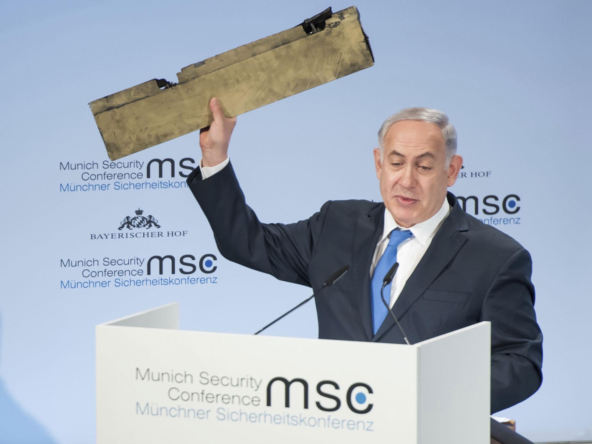 Benjamin Netanyahu, Israel’s Prime Minister, holds a part of a downed drone during his speech at the Munich Security Conference