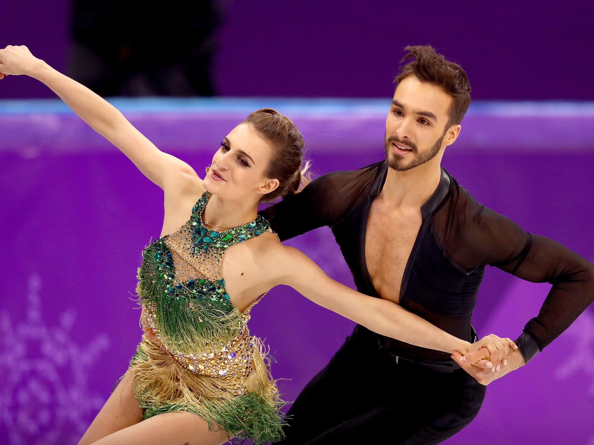 Gabriella Papadakis bravely completed her routine with Guillaume Cizeron after suffering a wardrobe malfunction