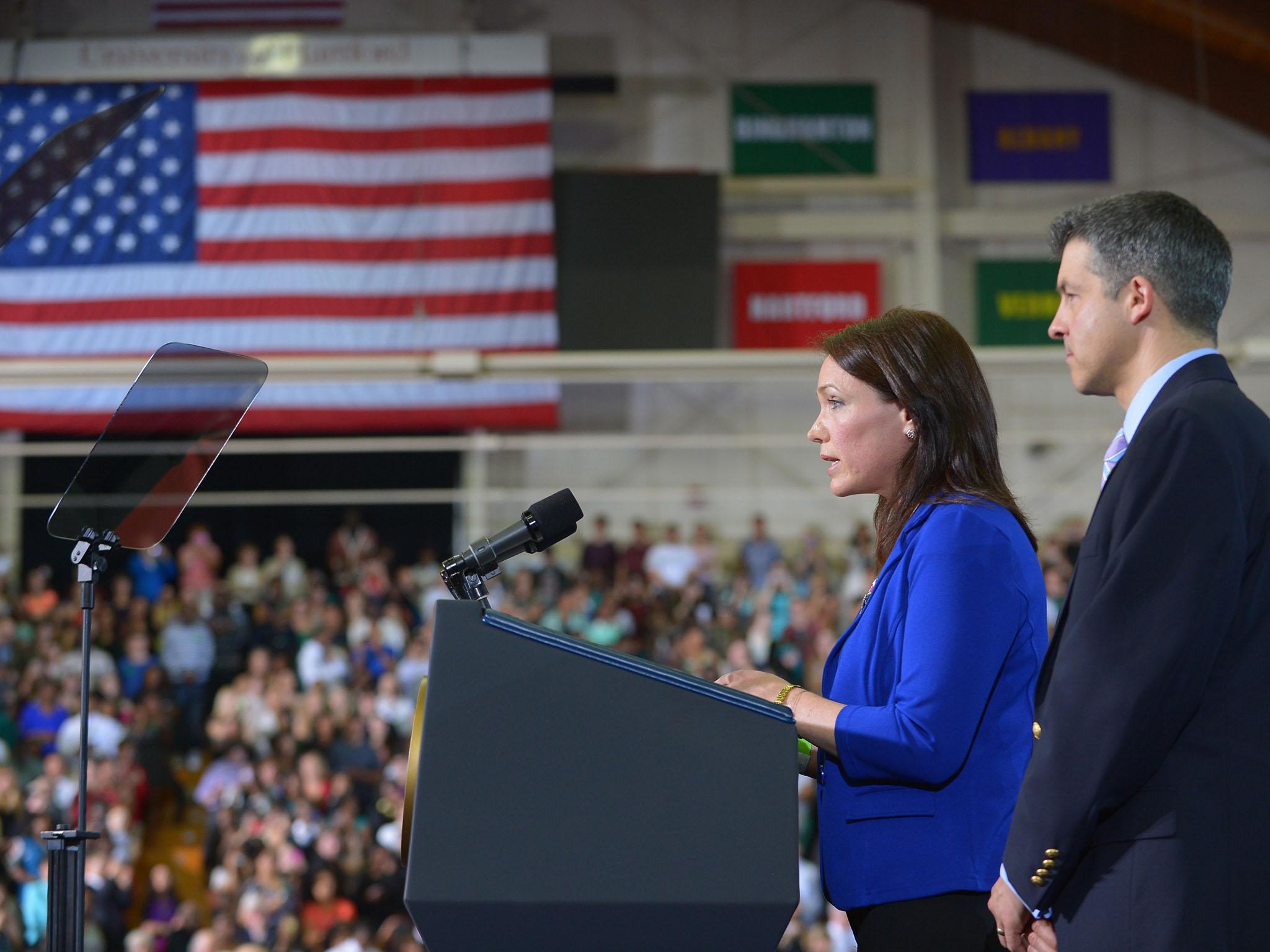 Nicole Hockley introduces US President Barack Obama as her husband Ian Hockley watches, during an event on gun control in 2013 at the University of Hartford, Connecticut