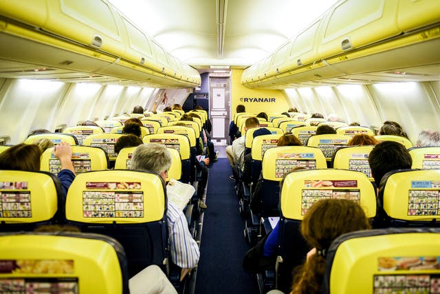 People are sitting on a Ryanair flight