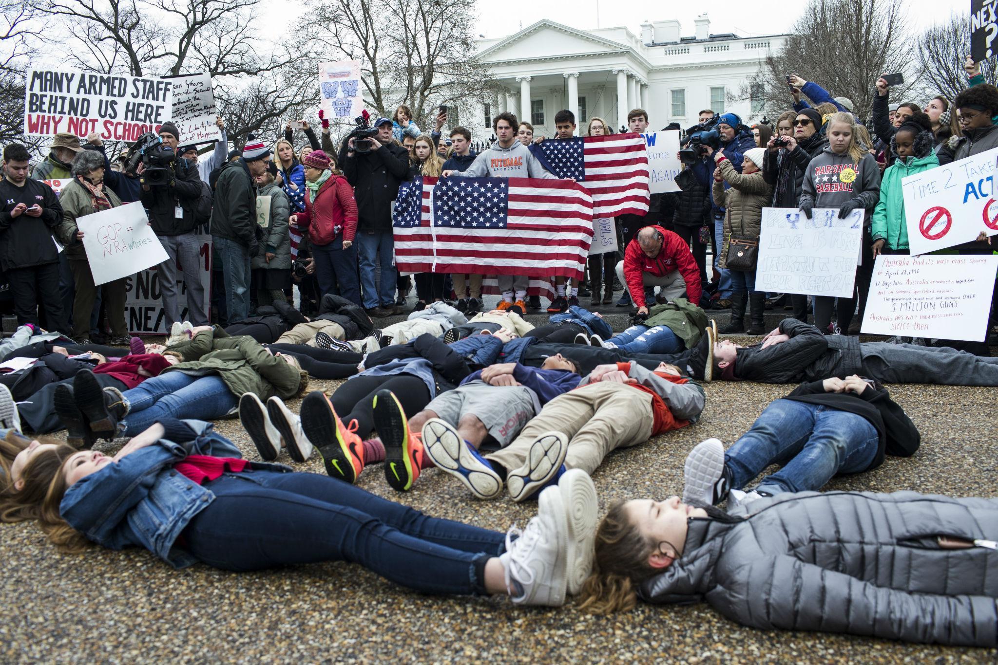 Teenagers stage a 'lie-in' demonstration supporting gun control reform near the White House