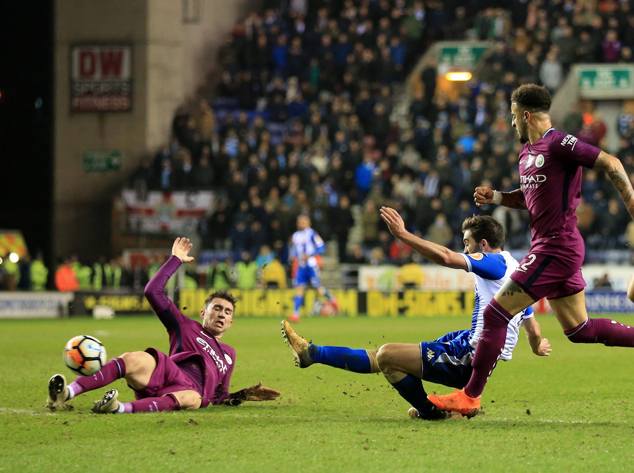 Will Grigg fires Wigan past 10 man Manchester City in feisty FA