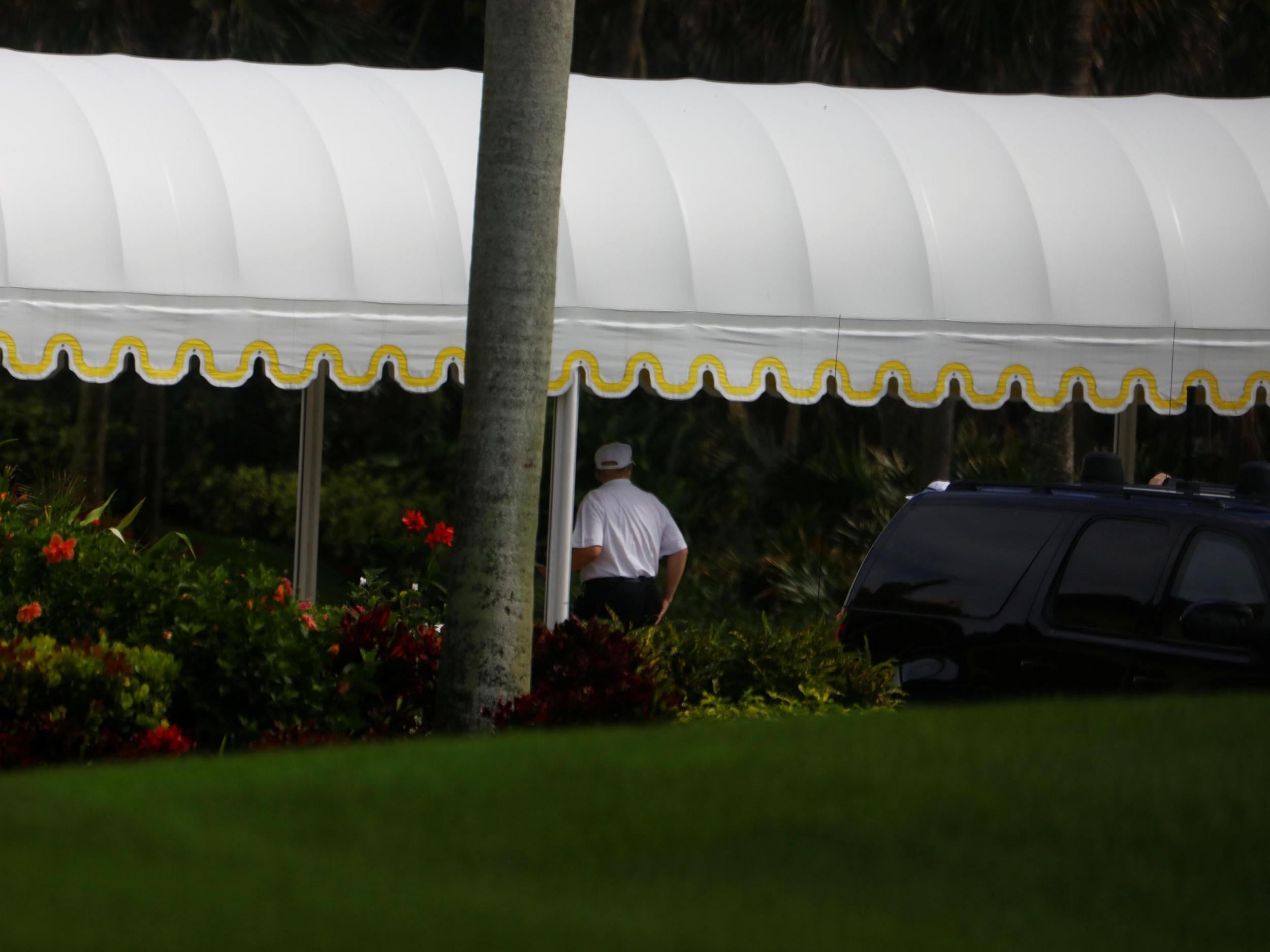 The President appeared to be dressed for a round as he arrived at his Mar-a-Lago estate in Palm Beach, Florida.