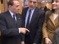 Berlusconi mocks female reporter with strong handshake