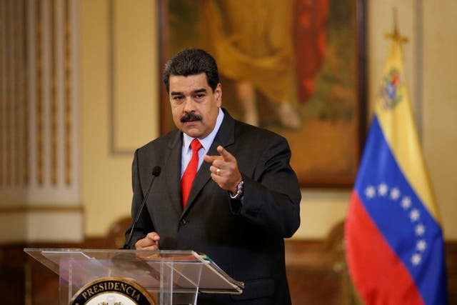 Venezuela's President Nicolas Maduro gestures as he talks to the media during a news conference in Caracas, Venezuela February 15, 2018
