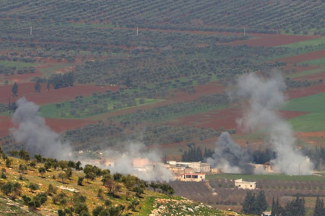 Turkish-backed Syrian rebel fighters fire from the town of Salwah, less than 10 kilometres from the Syria-Turkey border, towards Kurdish forces from the People's Protection Units (YPG) in the Afrin region.