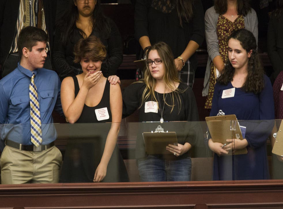 Students react to the vote not to debate the weapons ban in Florida