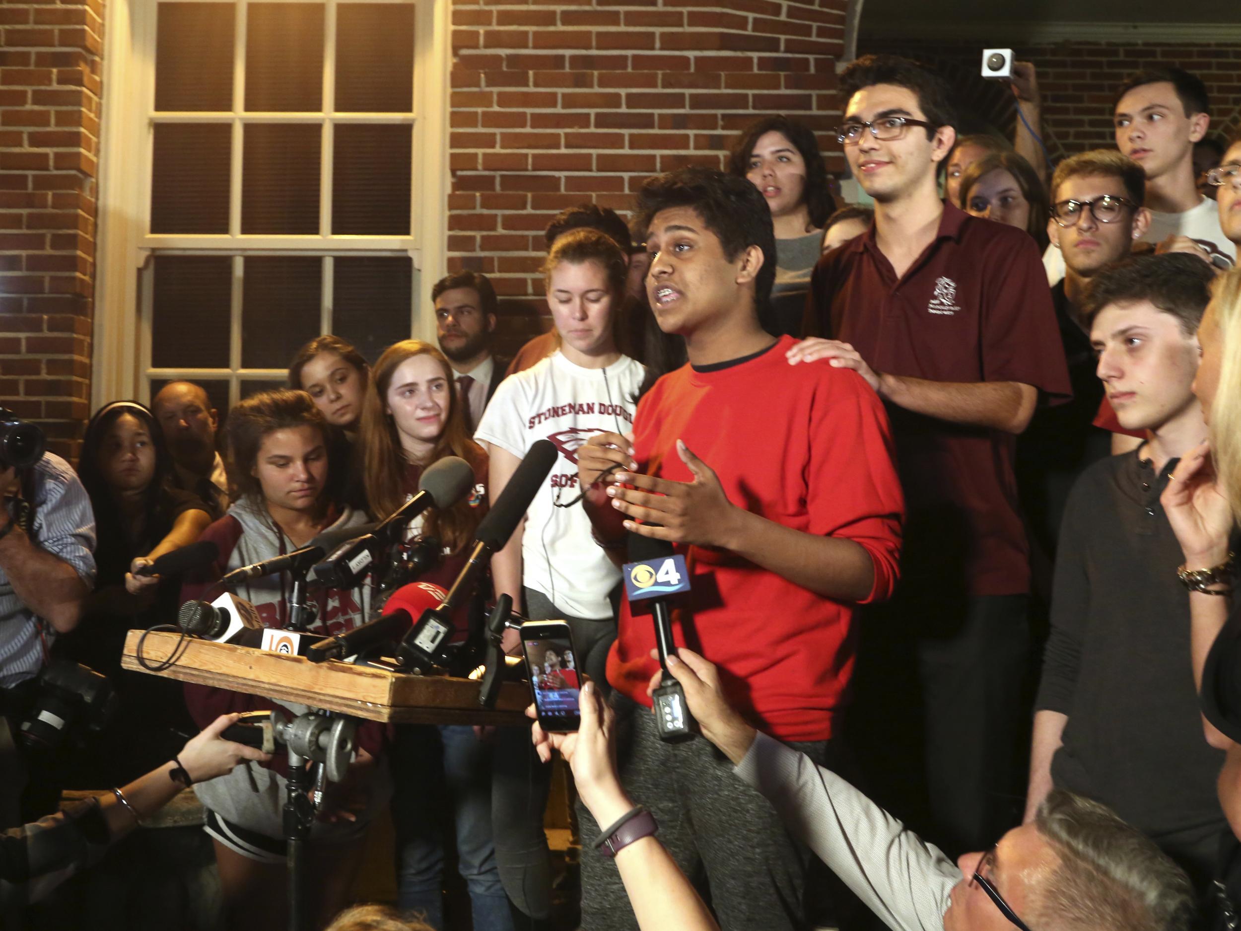Tanzil Philip, 16, a student survivor from Marjory Stoneman Douglas High School, where 17 students and faculty were killed in a mass shooting on Wednesday, speaks to a crowd of supporters and media as they arrive at Leon High School, in Tallahassee