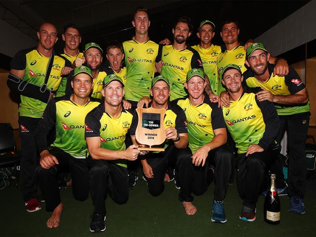 Australia celebrate their victory away from the rain