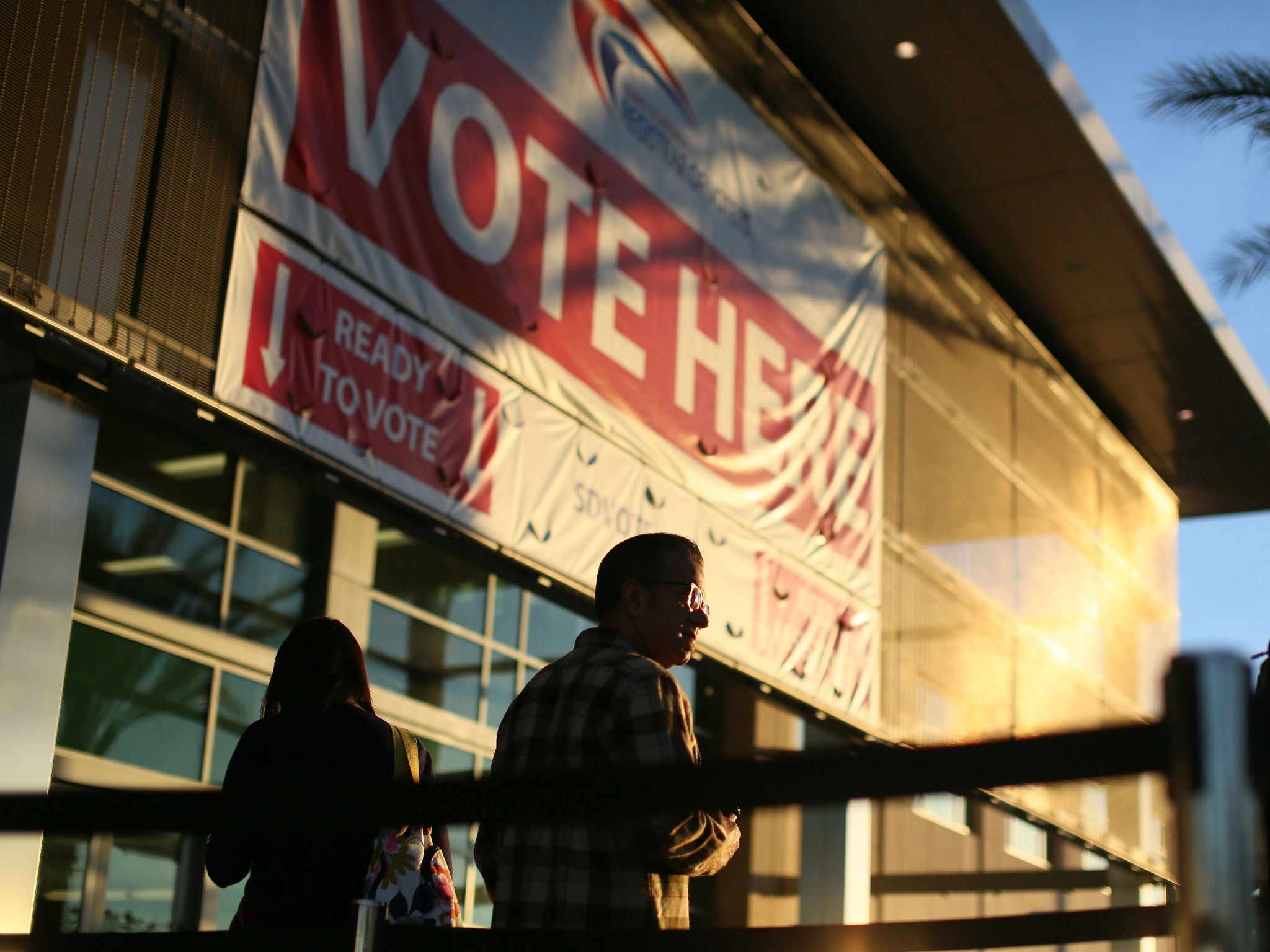 Voters wait in line at the San Diego County Registrar of Voters during the 2016 presidential election