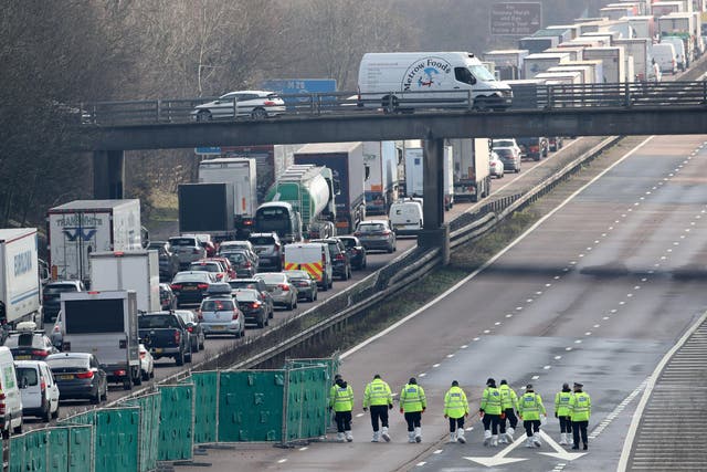 Police officers at work on the M20 near Ashford in Kent