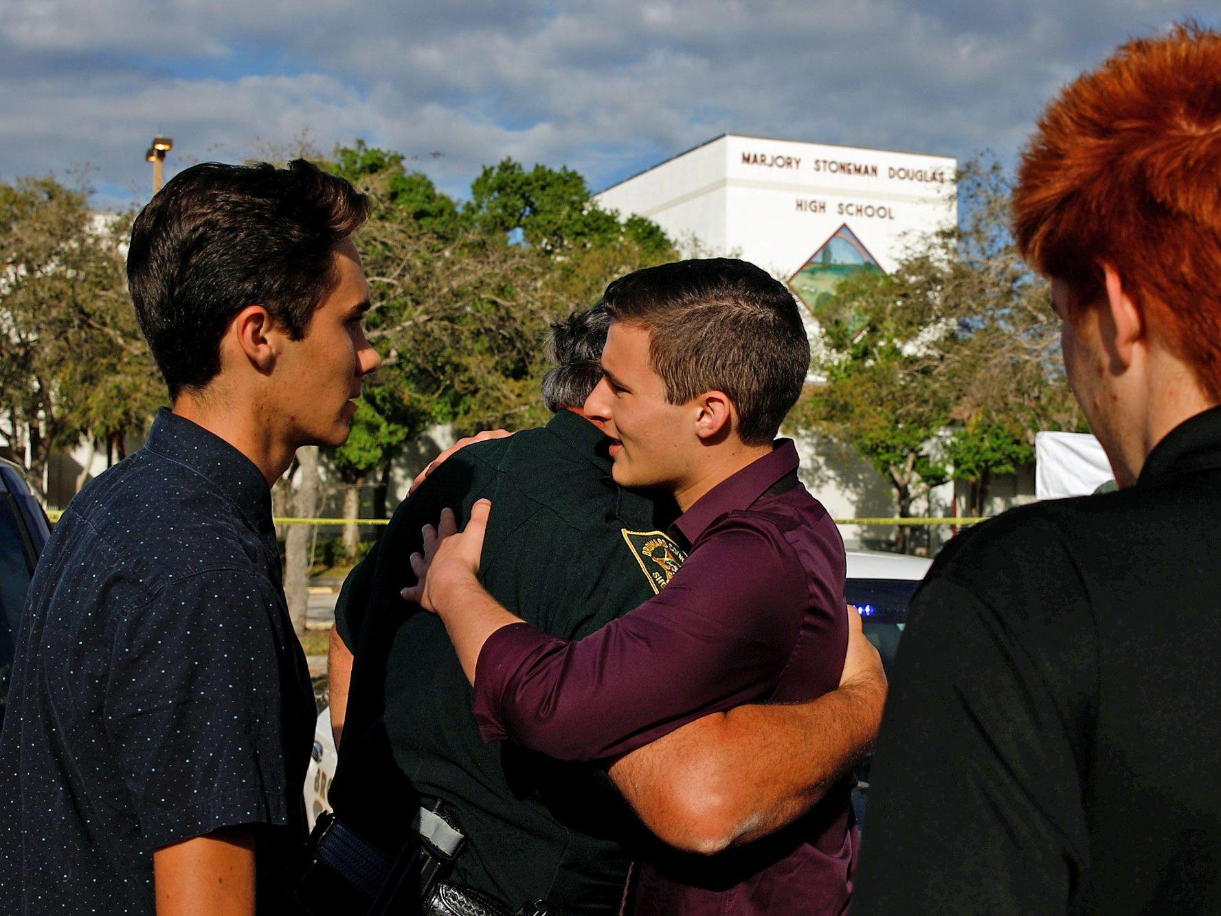 Kasky visiting the school again with police officers