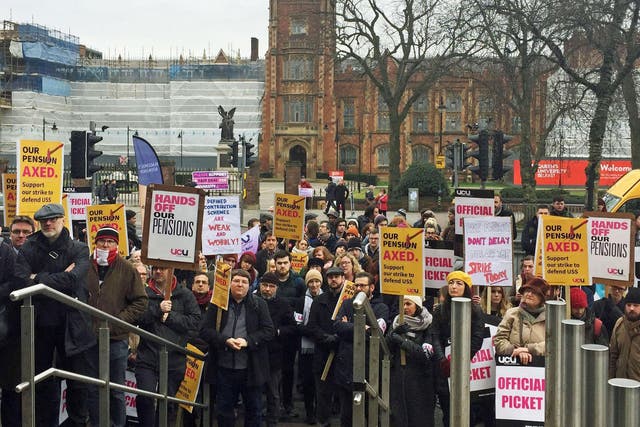 Demonstrators outside Queen's University Belfast as the first five-day strike began