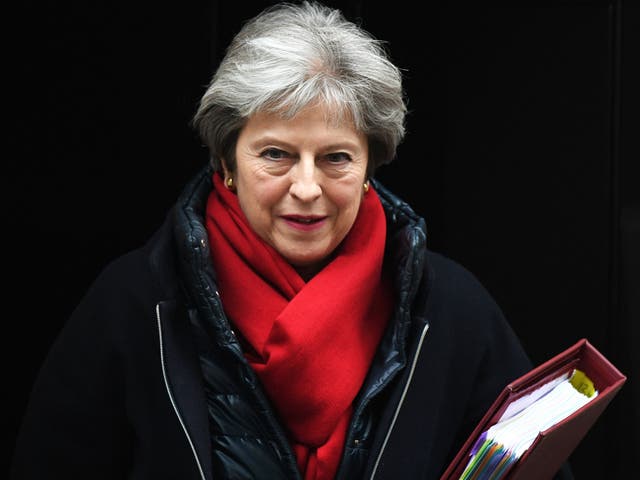 Theresa May leaves Downing street to attend Prime Minister's Questions