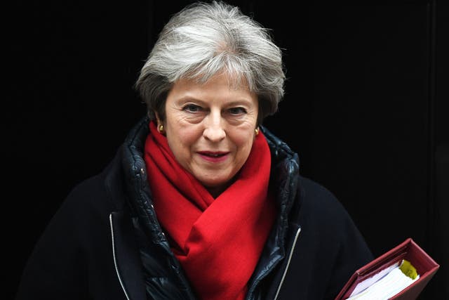 Theresa May leaves Downing street to attend Prime Minister's Questions