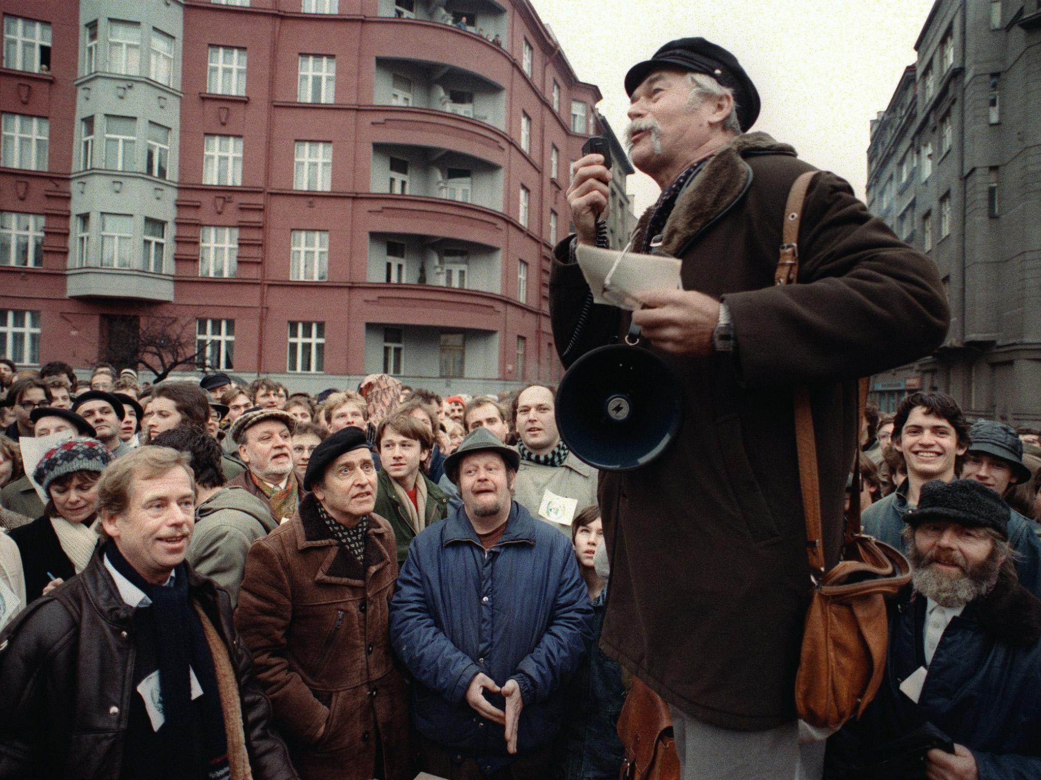 Vaclav Havel (left), a dissident playwright, and Rudolf Batek listen to Ladislav Lis address a crowd of demonstrators in 1988 in Prague (AFP/Getty)