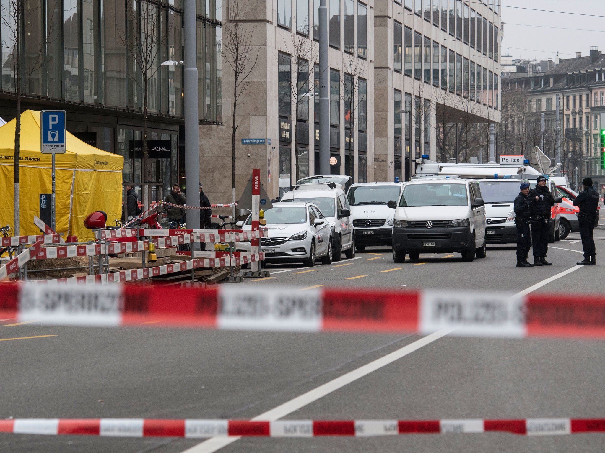 Forensic experts and Swiss police secure evidence at the scene