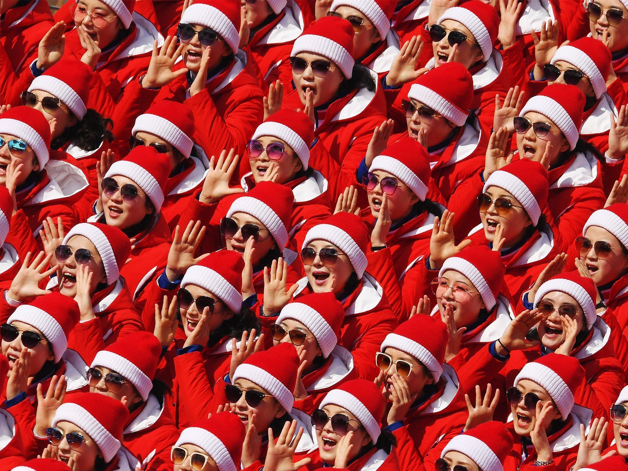 The North Korea cheerleader squad sing at the Winter Olympics in South Korea