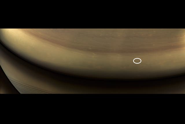 Composite image created from some of Cassini's final pictures shows where probe crashed into Saturn a few hours later