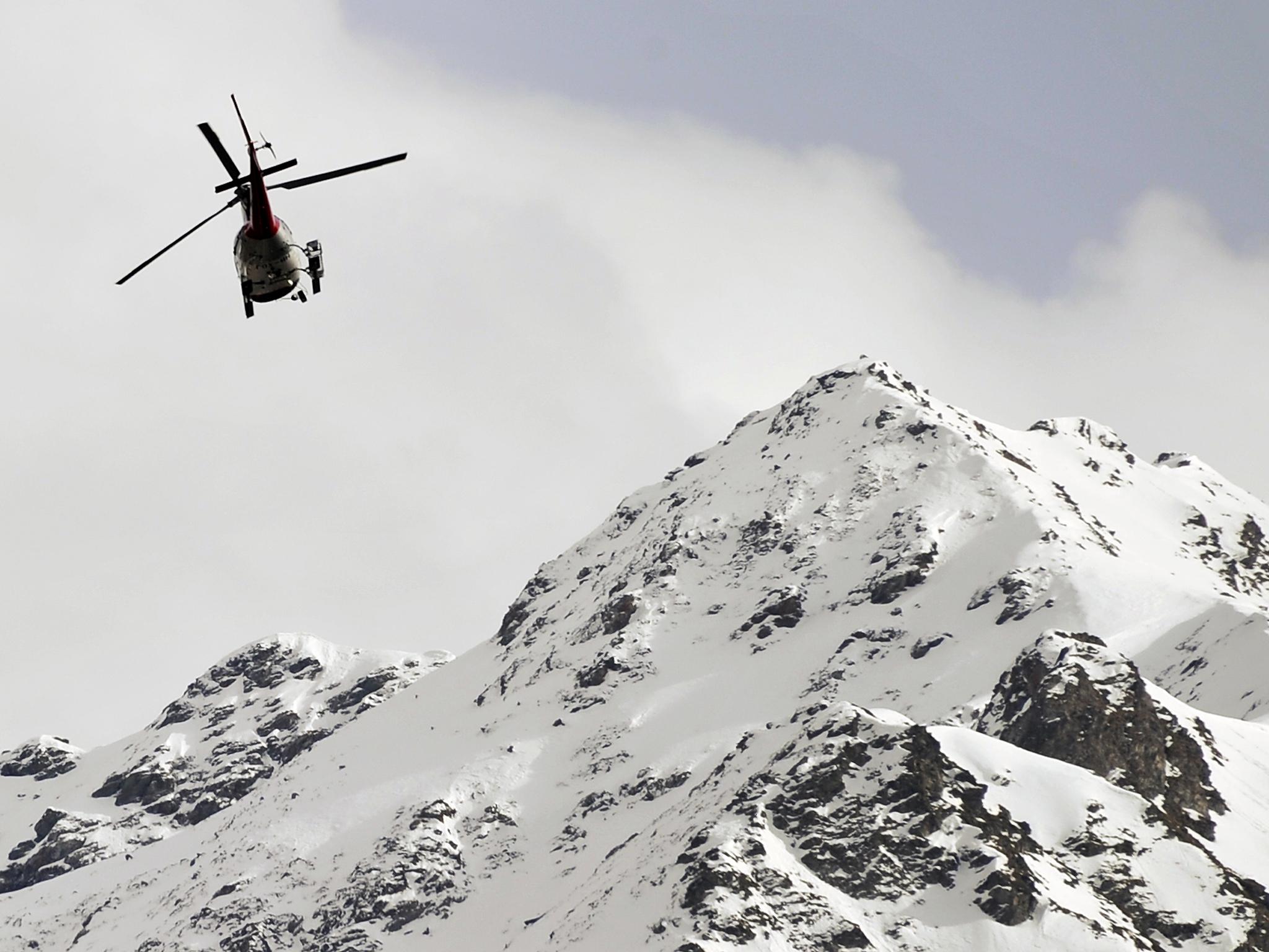 A helicopter flying over the Swiss Alps (File photo)