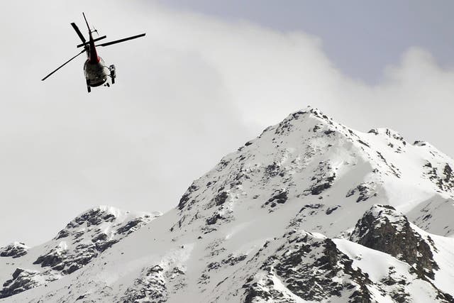 A helicopter flying over the Swiss Alps (File photo)
