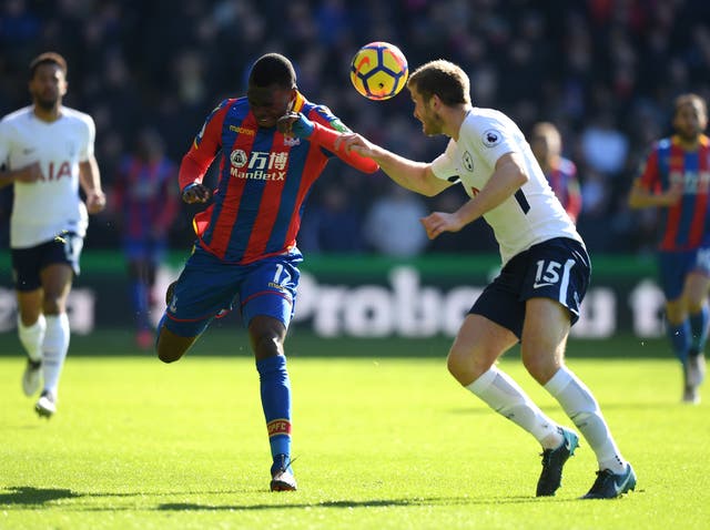 Eric Dier and Christian Benteke battle for the ball