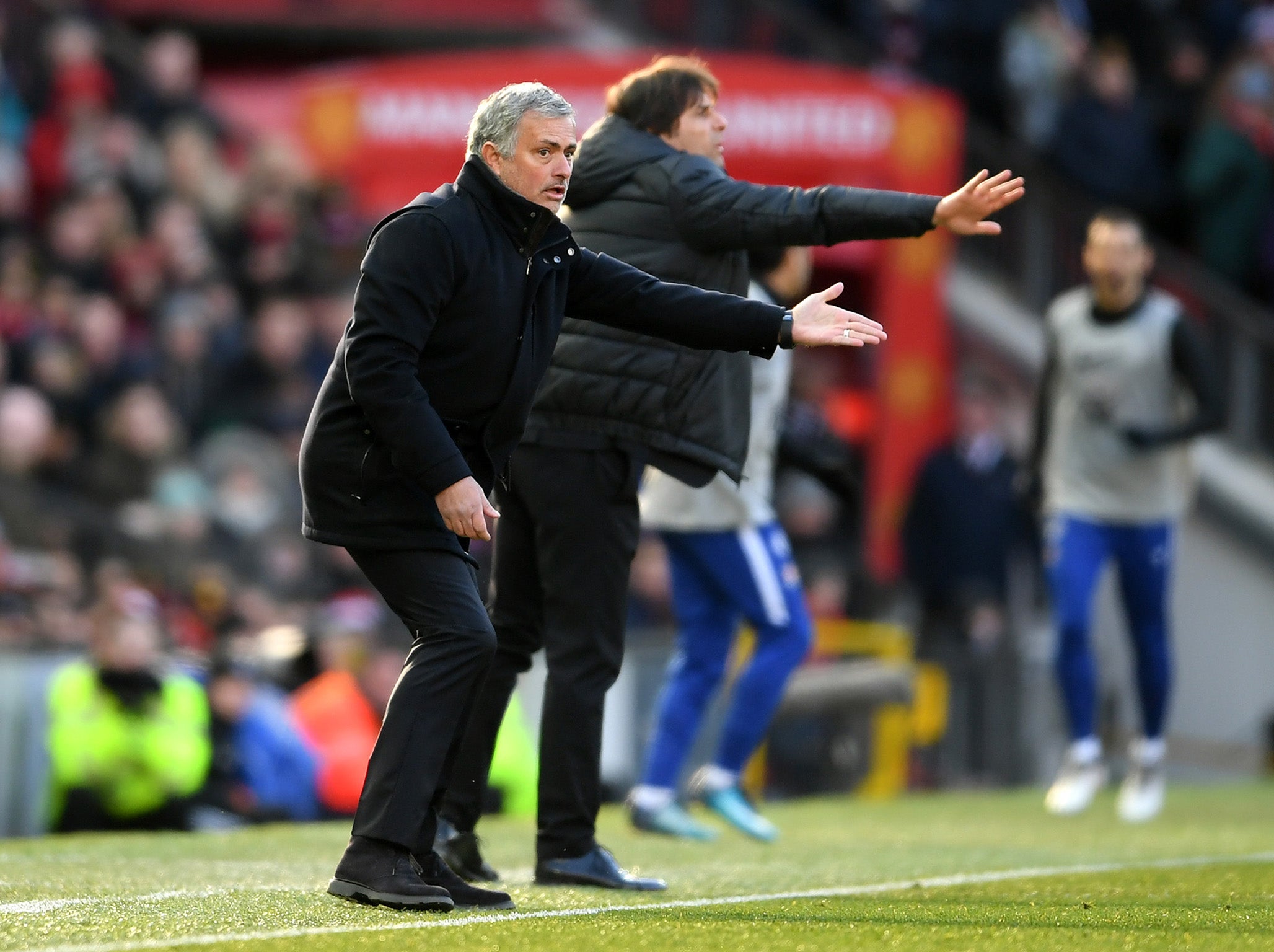 Jose Mourinho and Antonio Conte gesture from the touchline