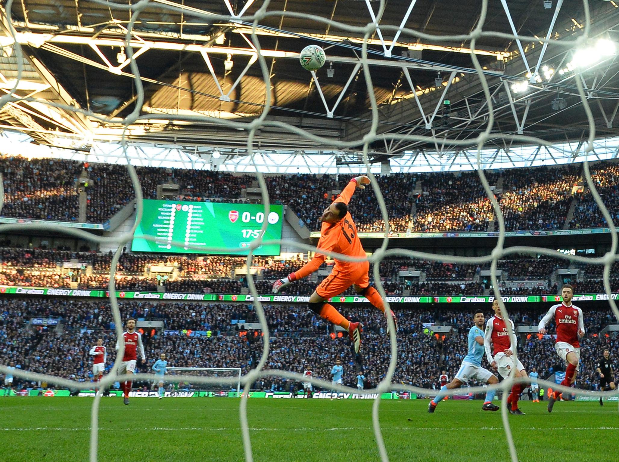 Sergio Aguero lifts the ball over David Ospina