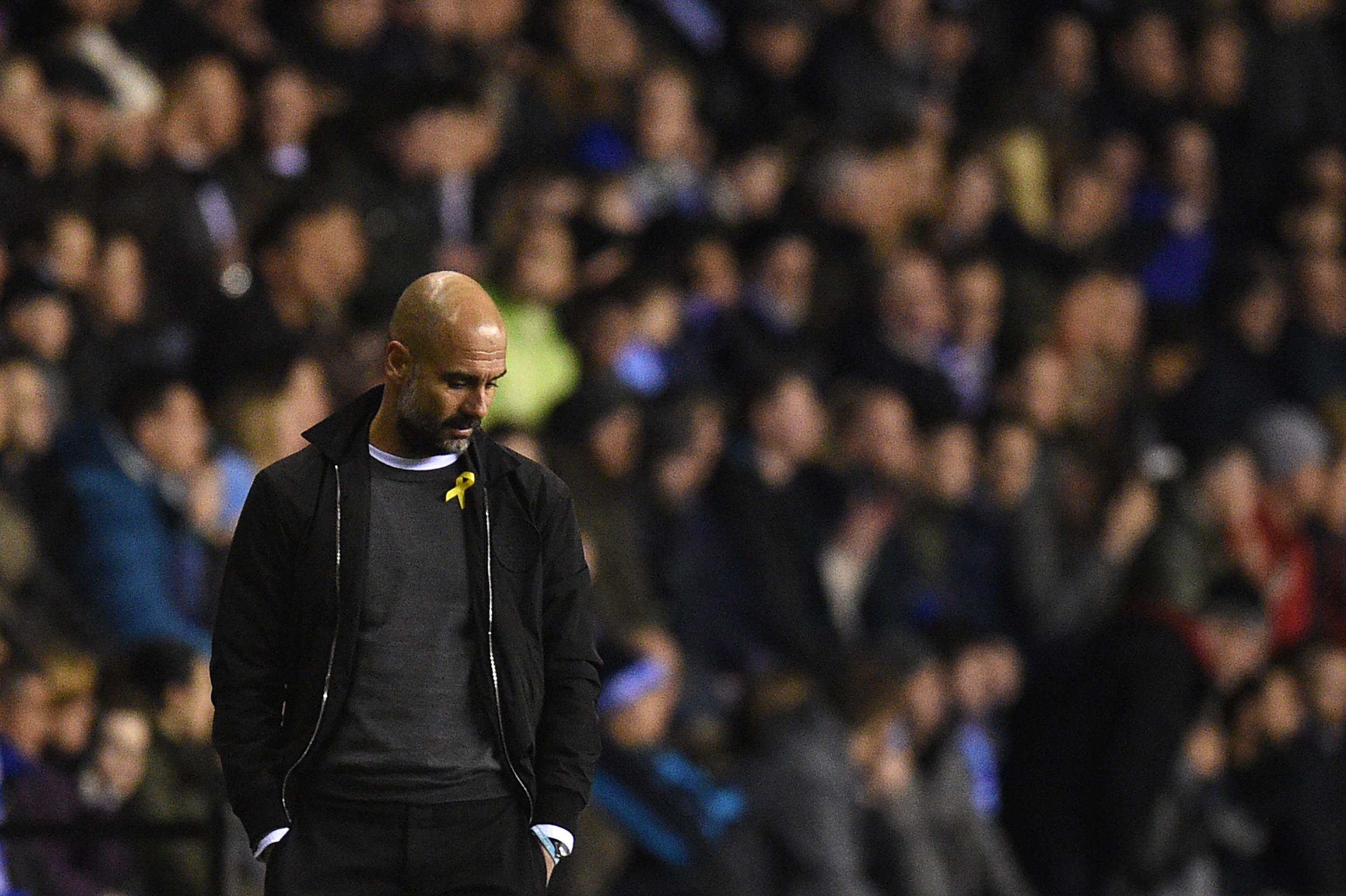Pep Guardiola has been wearing a yellow ribbon on the touchline