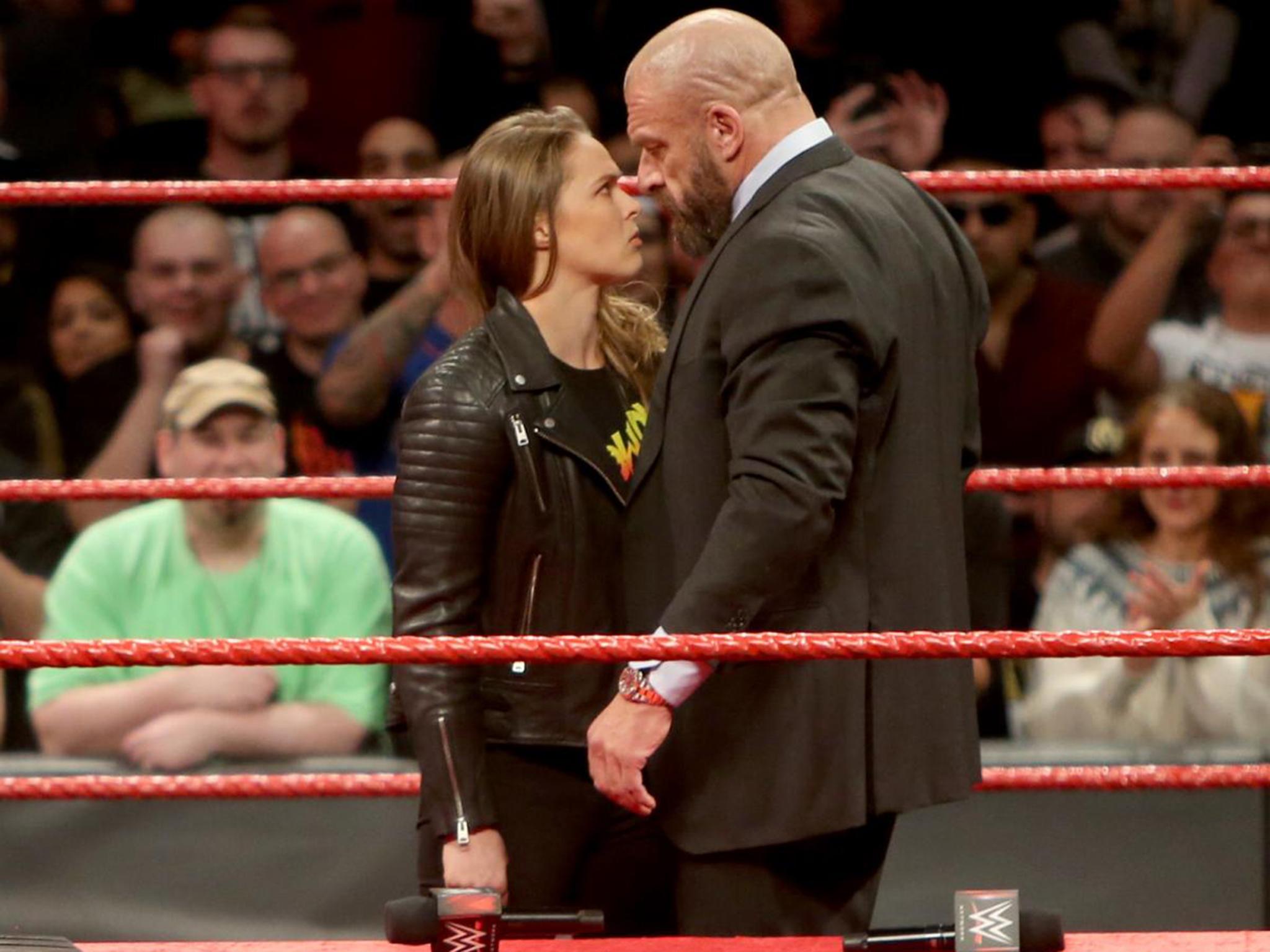 WWE Elimination Chamber results Ronda Rousey throws Triple H through a table after signing full-time contract The Independent The Independent image