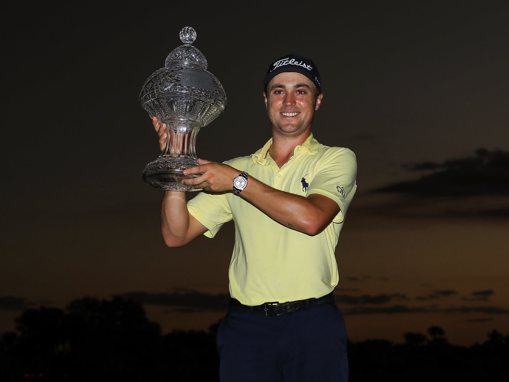 Thomas lifted the Honda Classic trophy under darkness