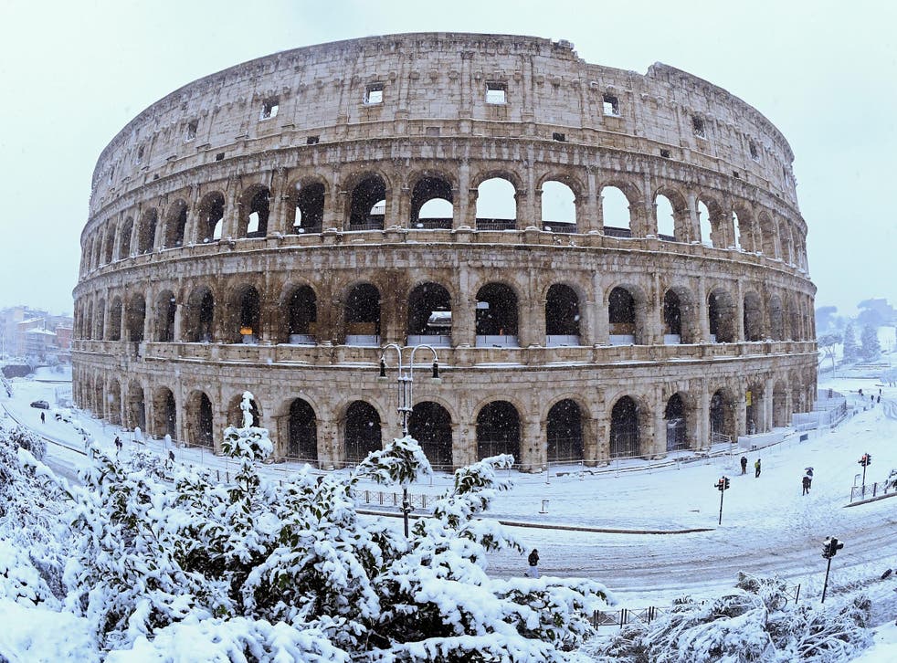 Colosseum is seen during a heavy snowfall in Rome, Italy