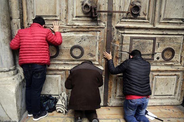 Worshippers locked out of the traditional site of Jesus' crucifixion and resurrection