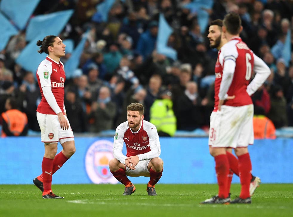 Arsenal's defenders look on after conceding against Manchester City at Wembley