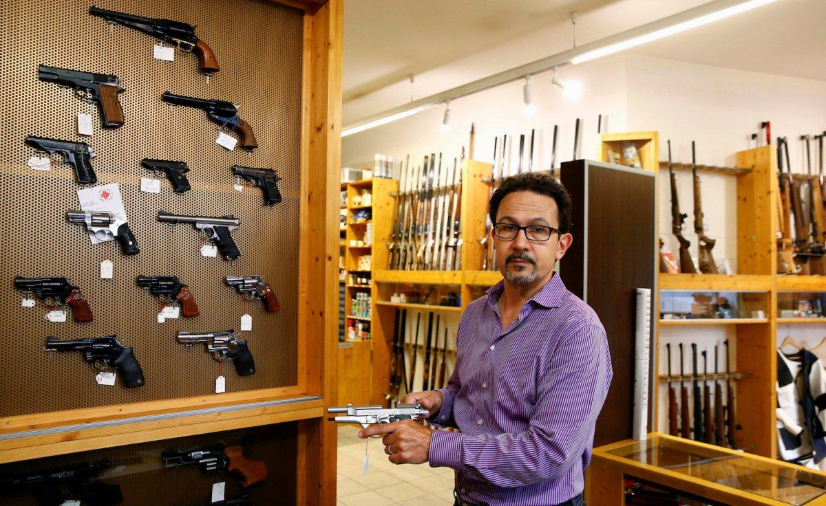 Daniel Wyss, the president of the Swiss weapons-dealers association, in a gun shop.REUTERS/Arnd Wiegmann