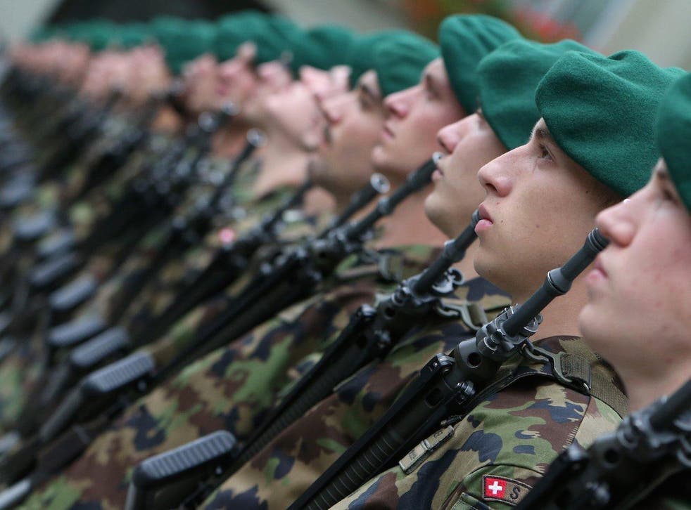 Members of the Swiss federal army's honor guard in October 2012.REUTERS/Thomas Hodel