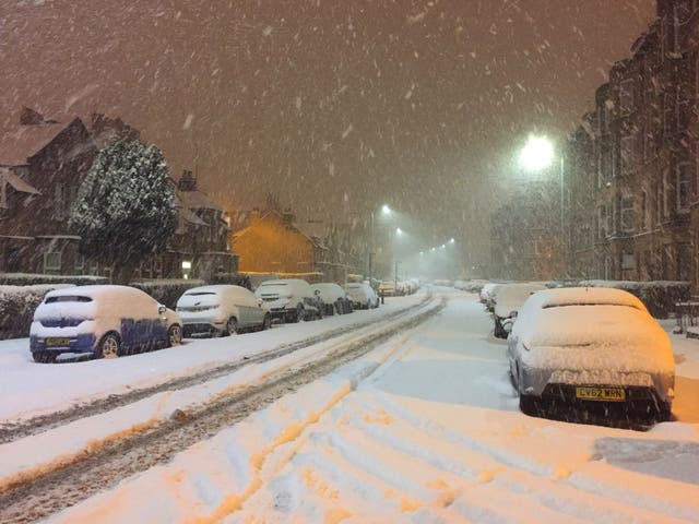 Snow falls in Shawlands, Glasgow, as wintry conditions have caused more misery for travellers overnight