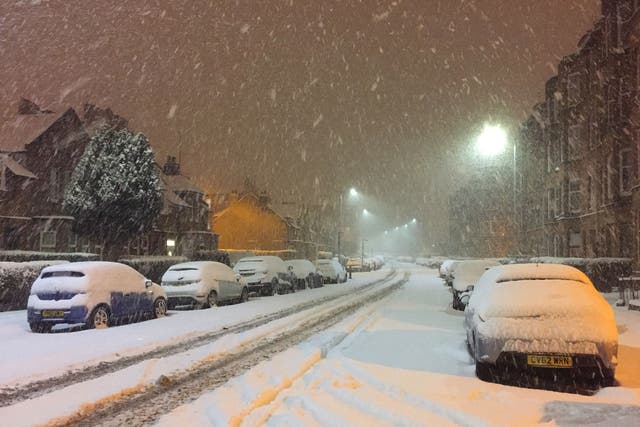 Snow falls in Shawlands, Glasgow, as wintry conditions have caused more misery for travellers overnight