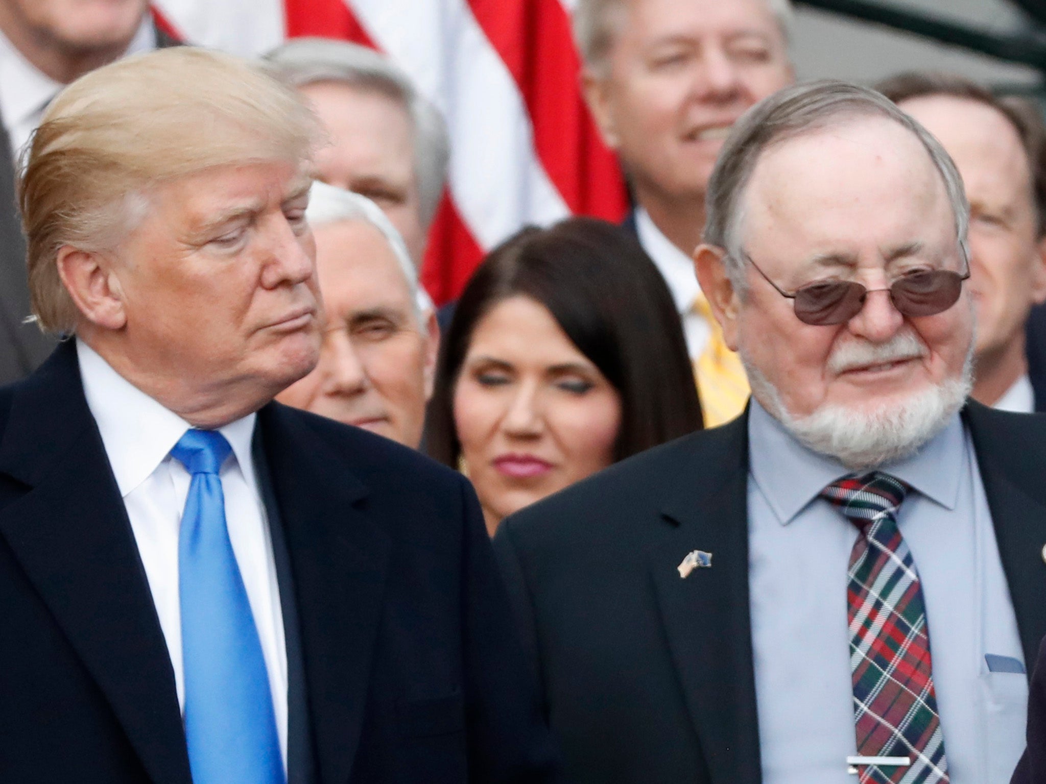 Donald Trump stands next to Alaska Congressman Don Young, who suggest Jews could have survived the holocaust if armed.