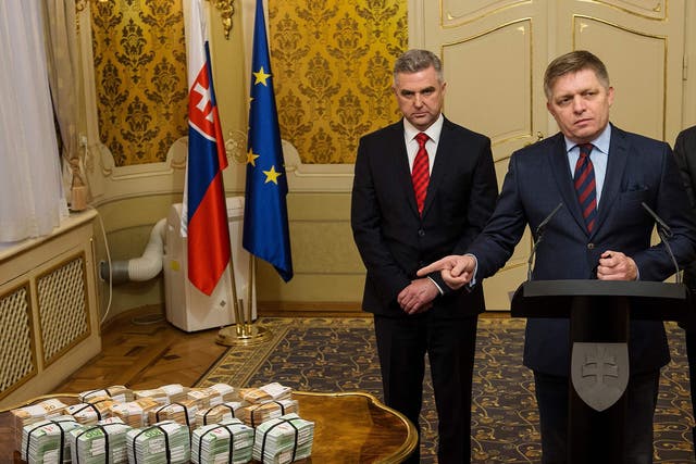 Robert Fico got the cash reward out and put it on the table. He denies any link to the mafia