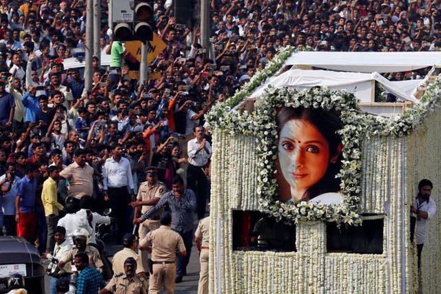 The body of Bollywood actress Sridevi is carried in a truck during her funeral procession in Mumbai