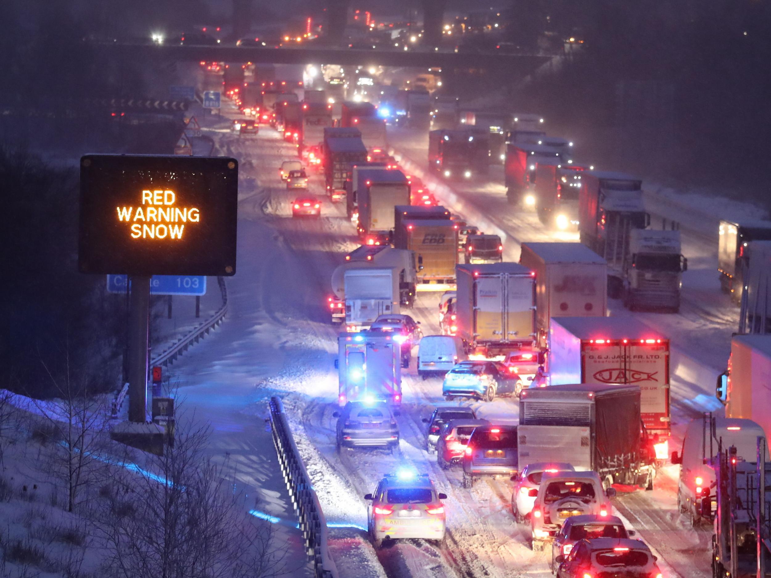 Traffic on the M80 near Glasgow, where hundreds of drivers were stranded overnight by heavy snow