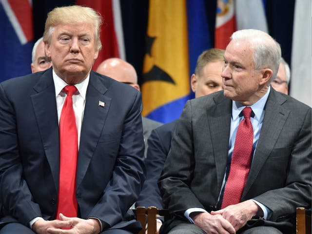 US President Donald Trump sits with Attorney General Jeff Sessions on 15 December 2017 in Quantico, Virginia.