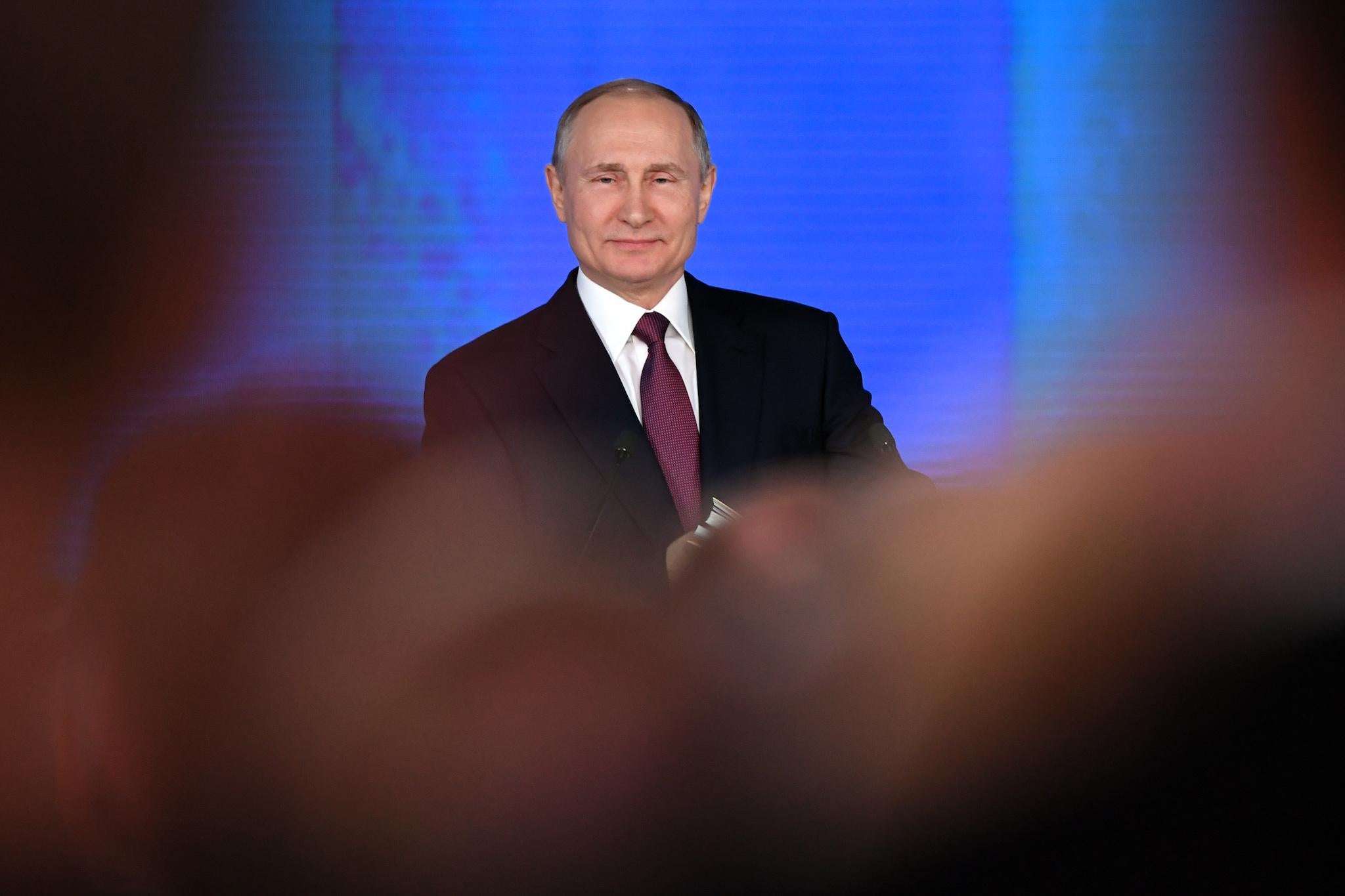 Russian President Vladimir Putin addresses the Federal Assembly at Moscow's Manezh exhibition centre on March 01, 2018