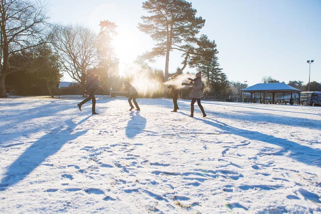 Pupils from Reigate Grammar School play in the snow